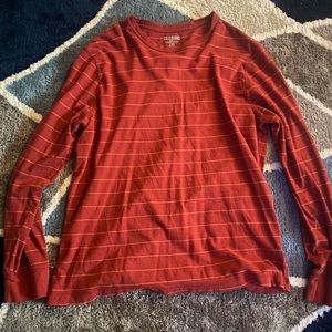 red crewneck with orange thin stripes